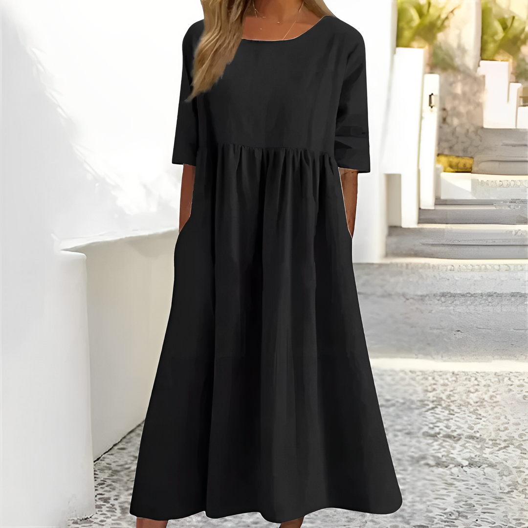 Elegancka sukienka midi Niva, idealna na wakacyjne okazje i letnie spotkania.