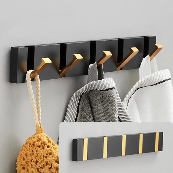 Elegancki czarny składany wieszak ścienny z aluminium. Minimalistyczny design do organizacji domu.