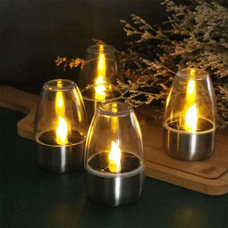 Elegancka solarna lampa LED świeca, doskonała jako dekoracja ogrodu i balkonu, tworząca nastrojowe oświetlenie zewnętrzne.