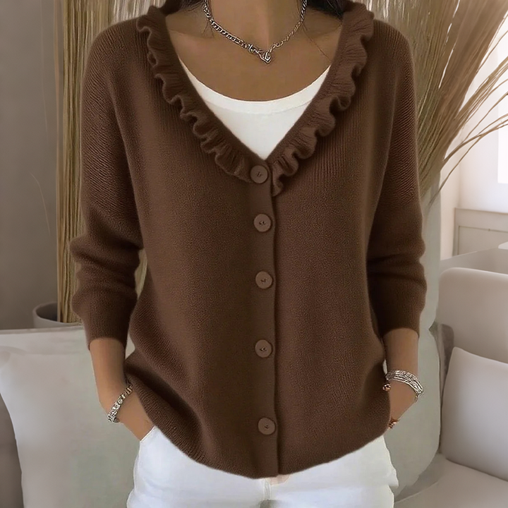 Elegancki damski sweter rozpinany z ozdobną falbanką na rękawie