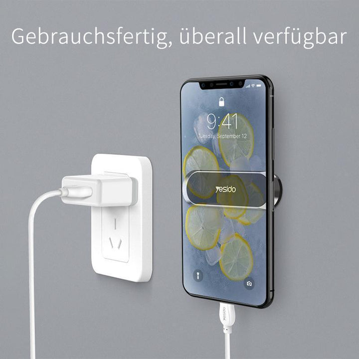 Magnetyczny uchwyt na telefon do samochodu, stabilny montaż bez śladów na desce rozdzielczej.