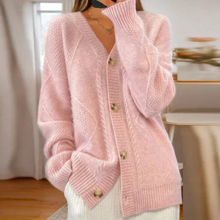 Różowy damski sweter rozpinany oversize z dekoltem V i wzorem w warkocze