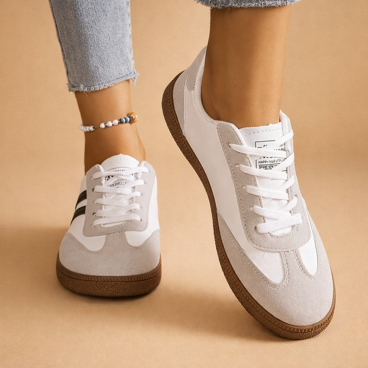 Modne, szare sneakersy damskie. Komfortowe buty na platformie, idealne do casualowych stylizacji.