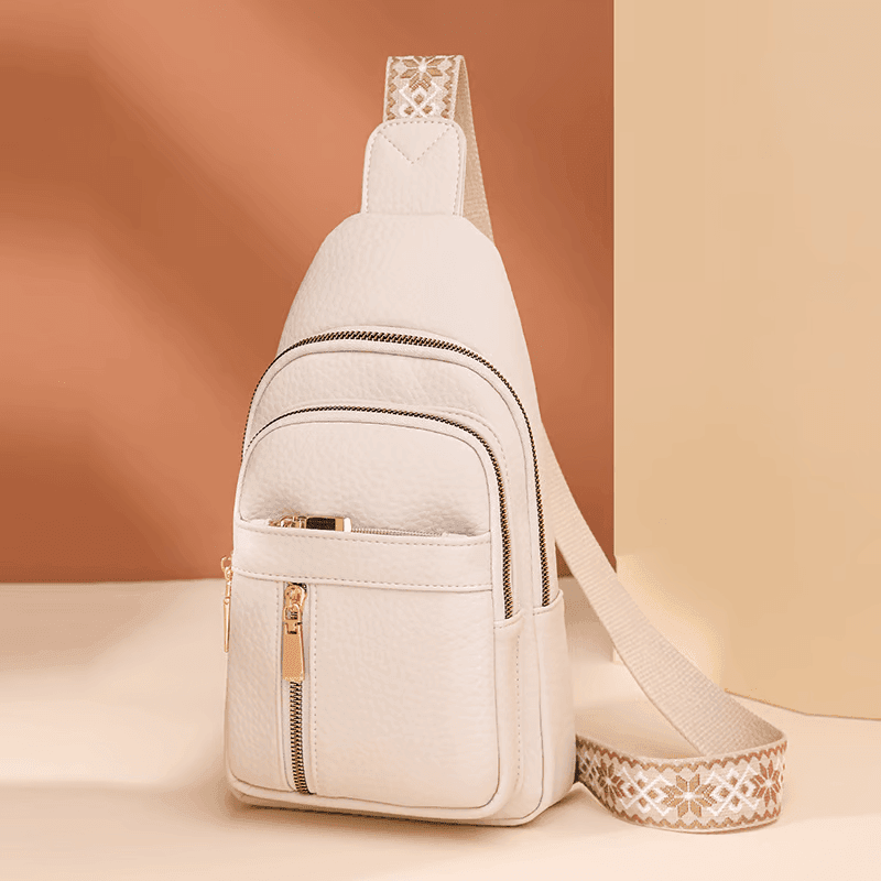 Modna, minimalistyczna skórzana torebka damska typu cross body, niezastąpiony element eleganckich akcesoriów.