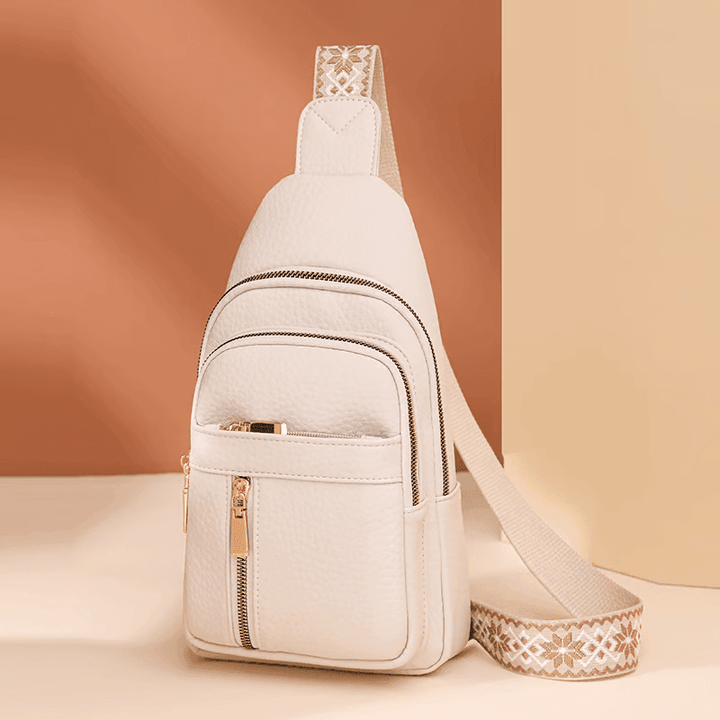 Modna, minimalistyczna skórzana torebka damska typu cross body, niezastąpiony element eleganckich akcesoriów.