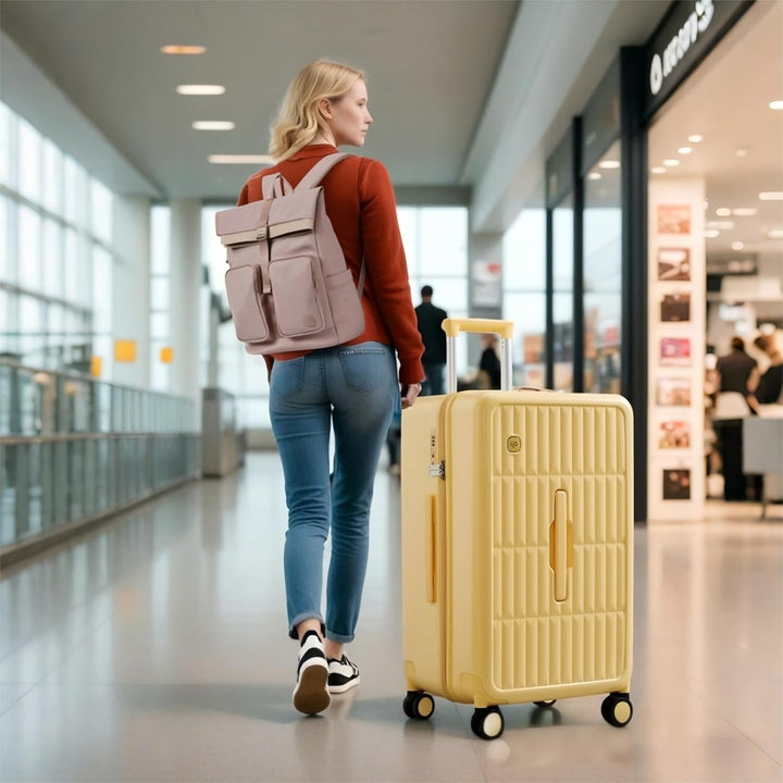Żółta duża twarda walizka podróżna 26 cali z 8 kółkami obrotowymi, idealna na bagaż rejestrowany.