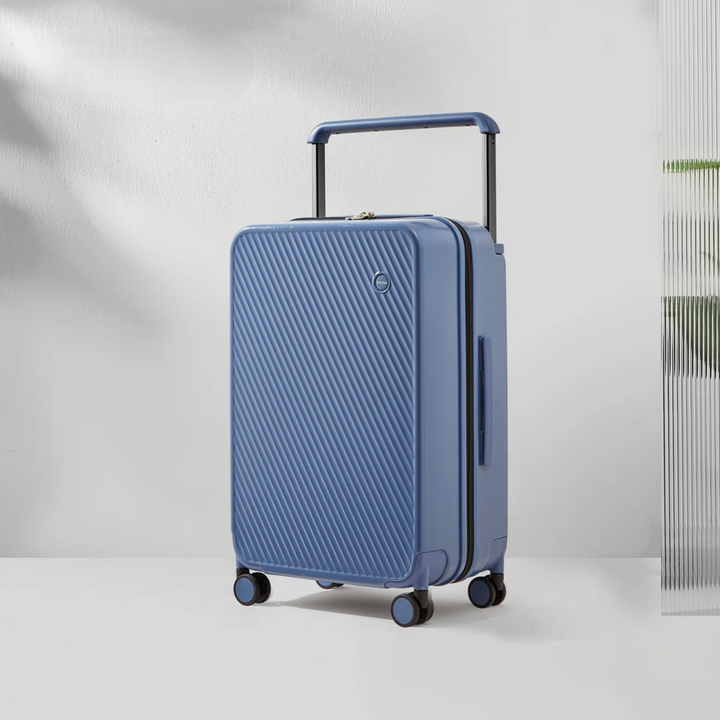 Twarda walizka podróżna z kółkami spinner i zamkiem TSA. Poliwęglanowa konstrukcja z szerokim uchwytem dla łatwego transportu.