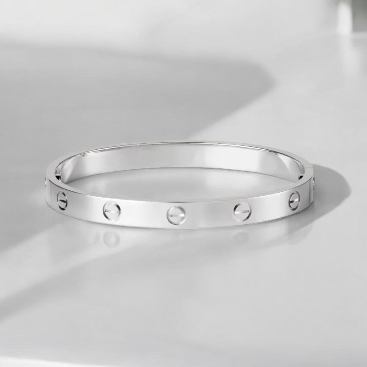 Elegancka uniseksowa bransoletka bangle ze śrubami, minimalistyczna złota biżuteria, idealna do stylizacji.
