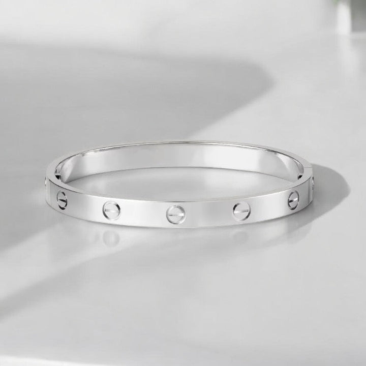 Elegancka uniseksowa bransoletka bangle ze śrubami, minimalistyczna złota biżuteria, idealna do stylizacji.