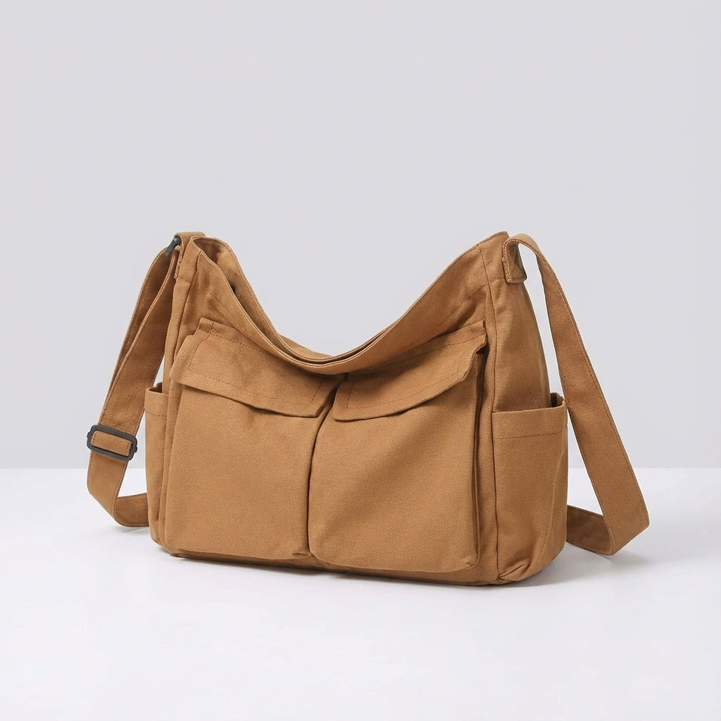 Uniwersalna płócienna torba crossbody listonoszka, z regulowanym paskiem na ramię, idealna dla każdego.