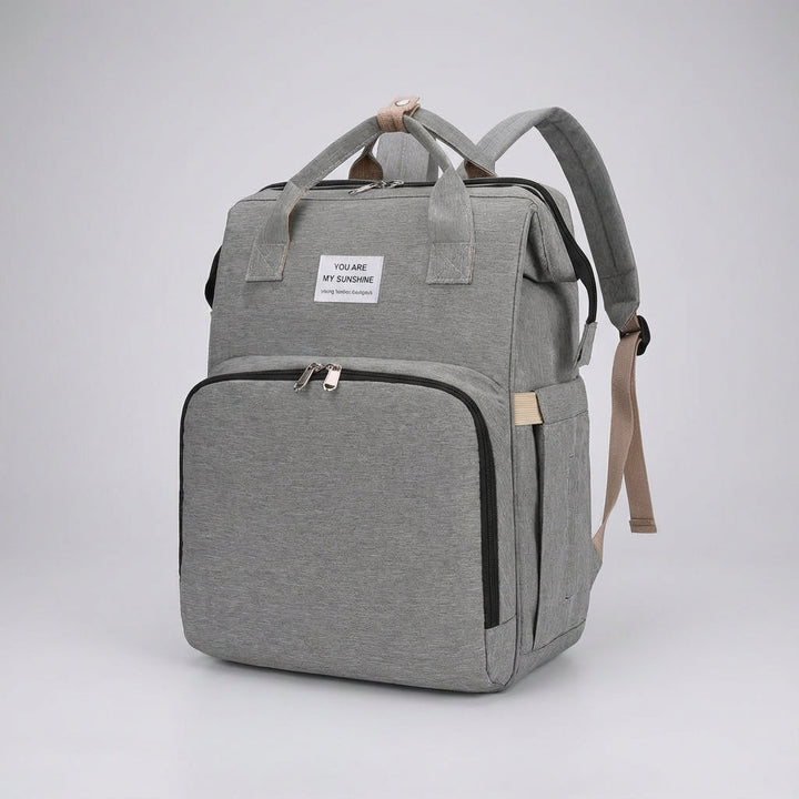 Wnętrze plecaka Babyroam z wieloma przegródkami, organizer na pieluchy, butelki i akcesoria dla dziecka.