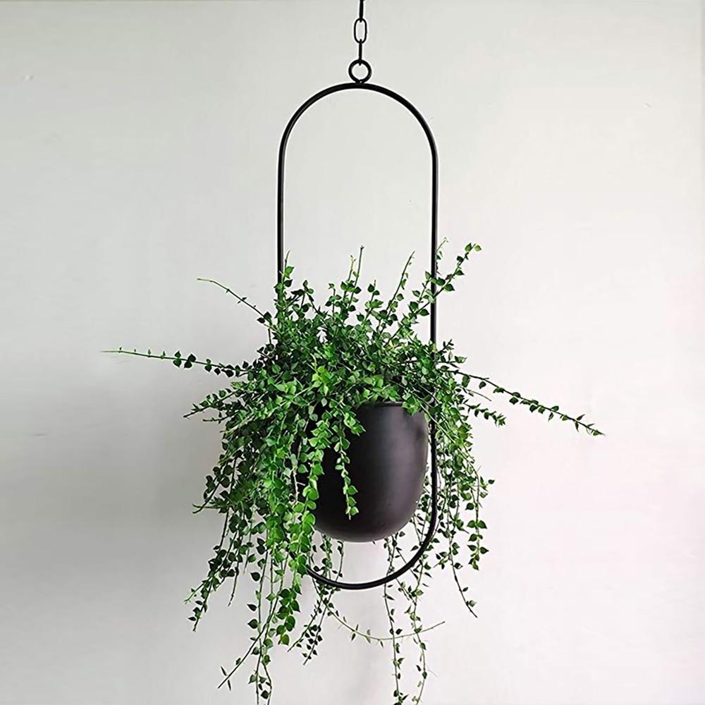 Nowoczesny metalowy wiszący kwietnik. Elegancki uchwyt na rośliny do domu i ogrodu. Minimalistyczny design.