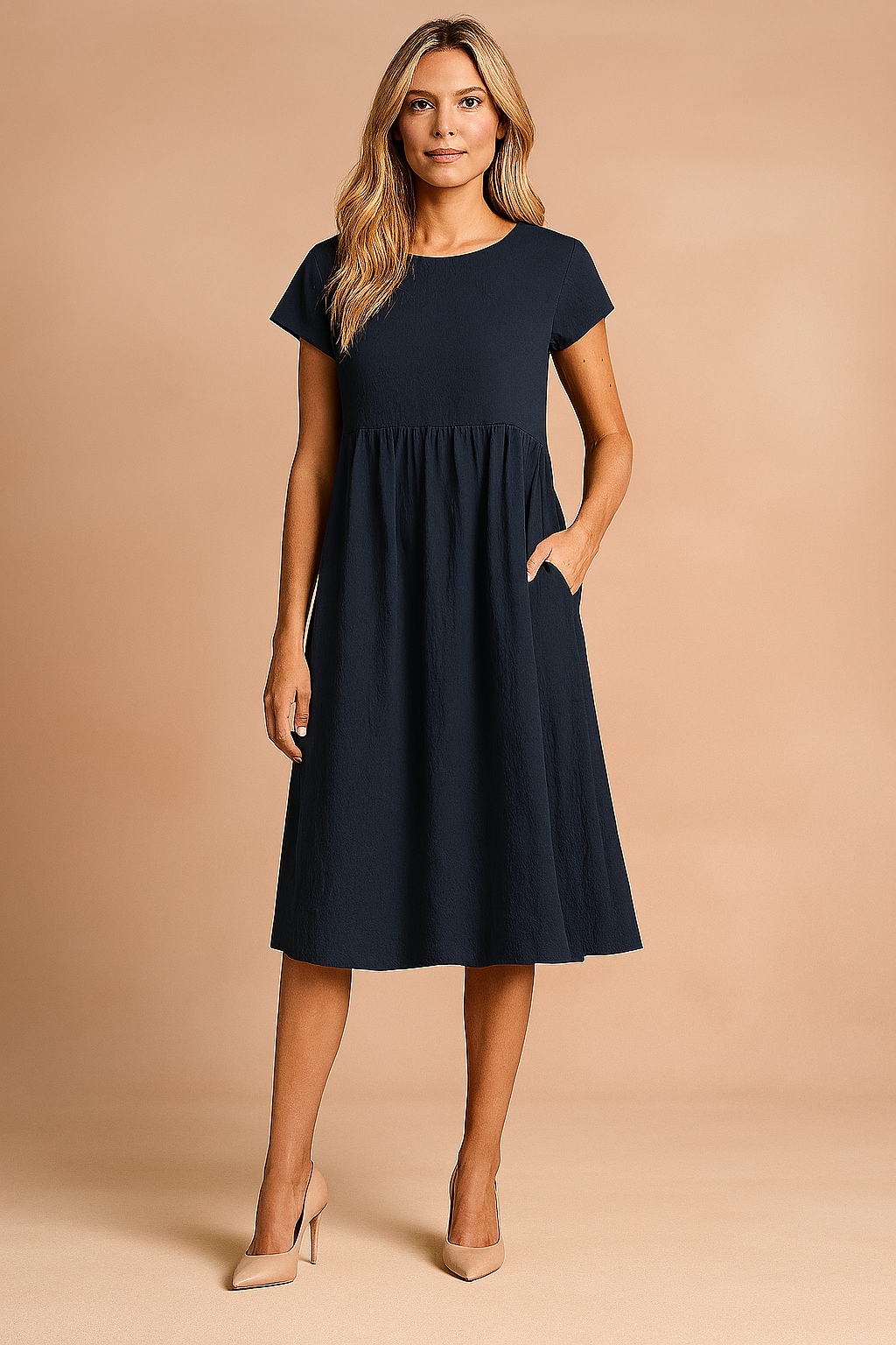 Zwiewna sukienka letnia midi damska basic, luźny krój, elegancka i codzienna stylizacja.